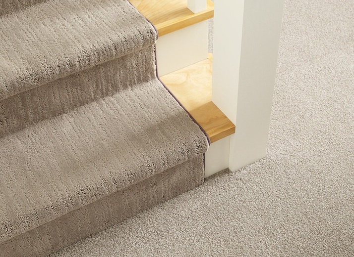 Cohesive look for staircase and room carpeting by Shaw Floors